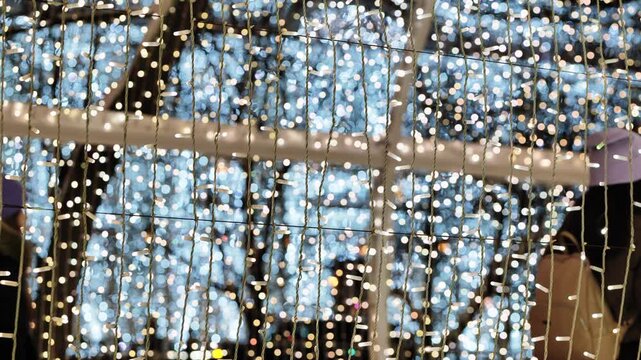 City lights illuminating festive nights, creating a sparkling holiday background