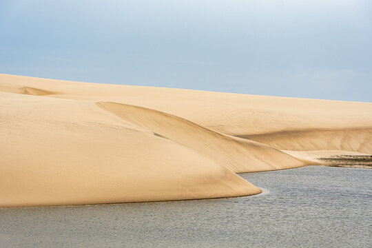 Dunes and lagoons of Atins, Lencois Maranhenses, Barreirinhas, Brazil. White sand dunes with pools of fresh water