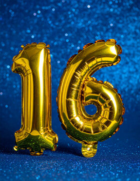 Golden balloon number 16 on shimmering deep blue glitter background, elegant anniversary celebration mood, clean festive composition.