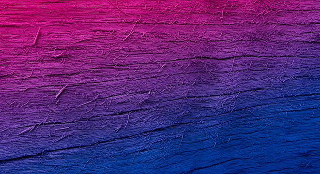 Textured wood grain surface with a vibrant pink to blue gradient overlay.