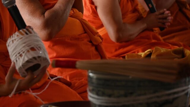 Thai monks while chanting in temple. Monk chanting is a meditative, spiritual practice aimed at cultivating peace, healing, mental clarity, and positive energy.