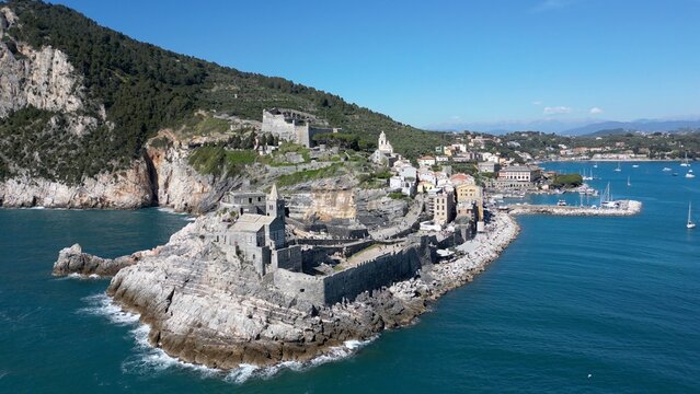 Italy, Liguria, The Church of San Pietro in Portovenere in the province of La Spezia, perched on a rocky spur overlooking the sea, is a Gothic-Genoese jewel from the 13th century - drone view 