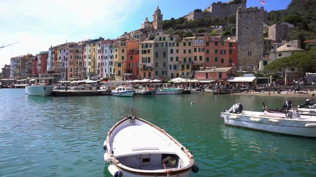 Italy, Liguria, 05,13,2026 The Church of San Pietro in Portovenere in the province of La Spezia, perched on a rocky spur overlooking the sea, is a Gothic-Genoese jewel  -typical colored houses 