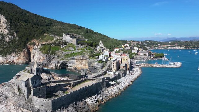 Italy, Liguria, The Church of San Pietro in Portovenere in the province of La Spezia, perched on a rocky spur overlooking the sea, is a Gothic-Genoese jewel from the 13th century - drone view 