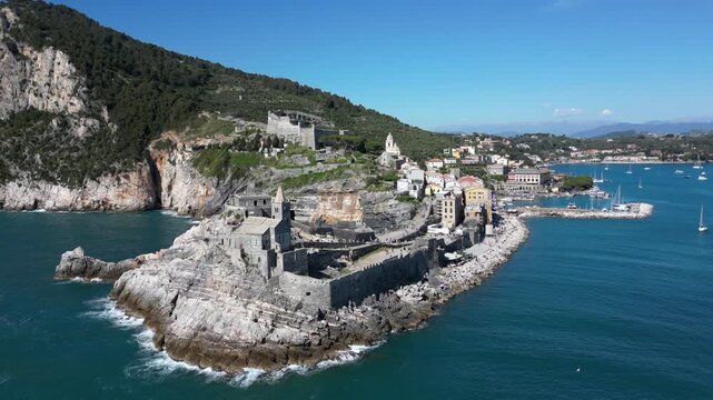 Italy, Liguria, The Church of San Pietro in Portovenere in the province of La Spezia, perched on a rocky spur overlooking the sea, is a Gothic-Genoese jewel from the 13th century - drone view 