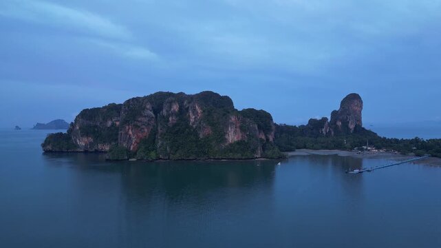 Krabi, Thailand  Tilt down aerial drone footage of the famous Railay beach with its landscape surrounded by karst in coastline of Krabi, Thailand on sunrise