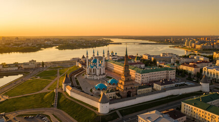 Obraz premium Aerial view of the Kazan Kremlin complex with Kul Sharif Mosque and Suyumbike Tower at sunset.