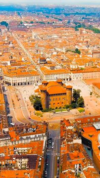 Vertical video. Turin, Italy. Palazzo Madama, a castle-palace with medieval towers and Baroque facade, Drone footage over Piazza Castello on a bright summer day. Drone footage, Point of interest. Ric