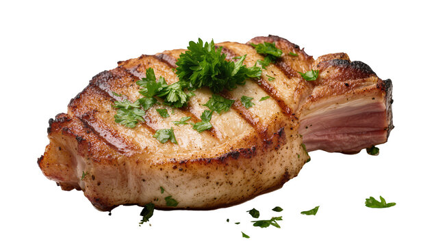Juicy grilled pork chop with fresh parsley garnish, isolated on transparent background