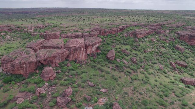 Aerial view of Badami Caves and surrounding terrain with rocky landscape