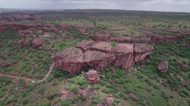 High angle shot of Badami Caves and surrounding terrain with rocky landscape