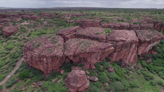 High angle shot of Badami Caves and surrounding terrain with rocky landscape