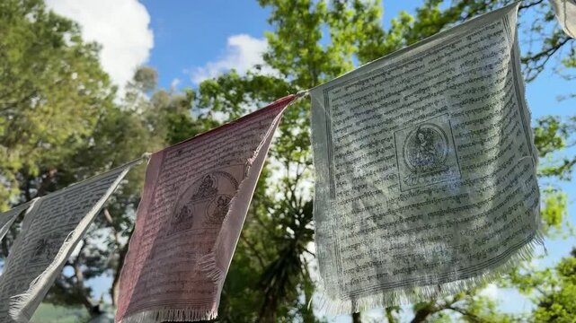 Tibetan Prayer Flags Lung ta Hanging in Nature Under Blue Sky