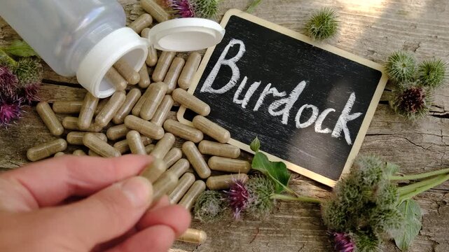 Burdock supplements in nature. Selective focus.