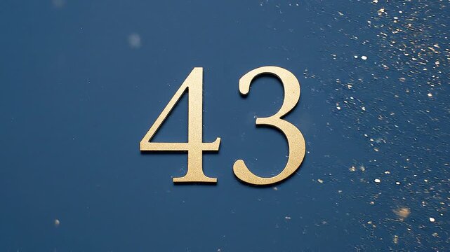 Gold Glitter Blow‑Away Reveal of Number 43 on Solid Background