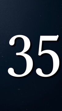 Gold Glitter Blow‑Away Reveal of Number 35 on Solid Background