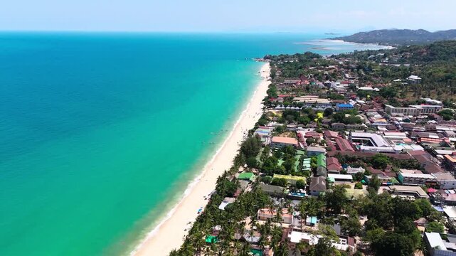 Lamai beach drone view on a nice day, blue sky and sea