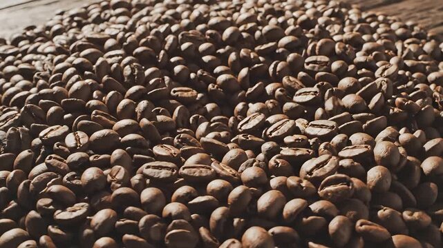 Closeup view of roasted coffee beans showcasing their rich texture and aroma.