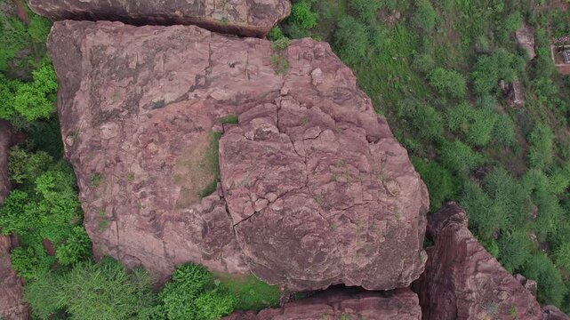 Bird&rsquo;s Eye View of historic Badami Caves with natural terrain and rugged rocky formations