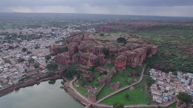 Drone view of Agastya Lake beside Badami Caves with scenic surroundings