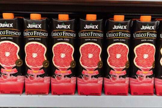Villa de Alvarez, Colima. Mexico. April 14, 2026: Row of Jumex Unico Fresco Toronja Juice Cartons Displayed on a Supermarket Shelf