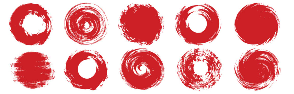 Collection of hand-drawn red paint circles, distressed ink stamps, and textured brush strokes isolated on white background. Artistic design elements.
