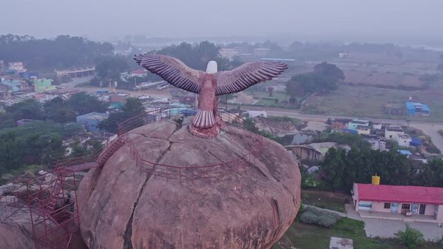 Drone view of Eagle sculpture or Jatayu Garuda statue with outstretched wings on top of big rock