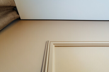 Decorative ceiling details. Elegant architectural interior accents. Refined interior design with detailed cornice. Sophisticated ceiling molding highlighting textures and graceful geometry © Aleksey