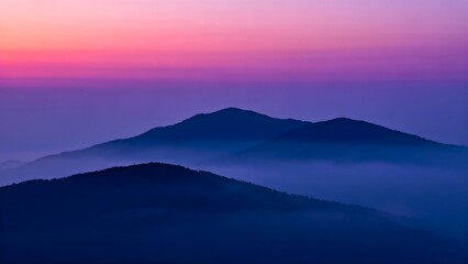 Fototapeta premium Mountain landscape at dawn with fog