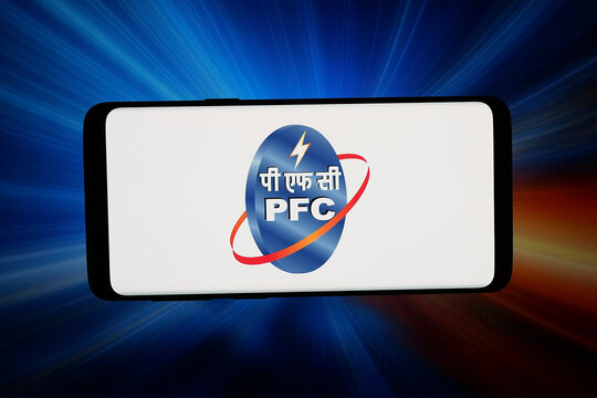 Stuttgart, Germany - 05-08-2026: In this photo illustration, the logo of company Power Finance Corporation Ltd. (PFC) is displayed on a smartphone in front of abstract background on computer screen.