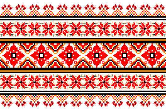 Traditional geometric ethnic seamless pattern in red, black, and orange colors on white background for fabric or wallpaper design.