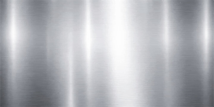 A polished silver stainless steel plate features a brushed metal texture with a smooth industrial pattern and shiny metallic reflections on a grey aluminum surface