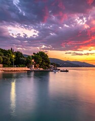 Obraz premium Serene lake at sunset with mountains.