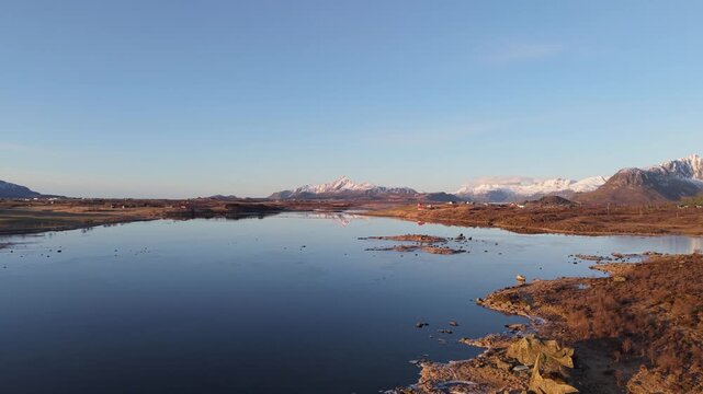 Exploring a large lake and mountains during sunset in a remote area of nature