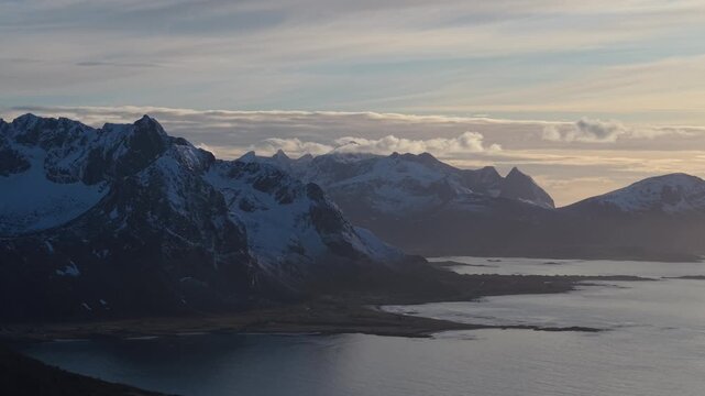 Mountains and water at sunset in Norway with changing light and clouds