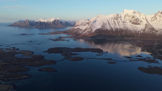 Mountain landscape view of water and islands in northern Norway during sunset hours