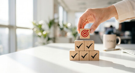 Goal achievement concept with hand placing target wooden block on checkmark pyramid © YASAWARDHANA