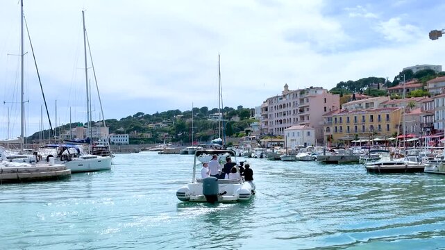 Small Motorboat Navigating Through the Scenic Harbor of Cassis France