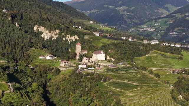 Aerial view of juval castle nestled in the alpine valley