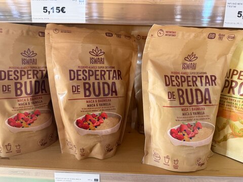 Calvia, Spain - May 05, 2026: Iswari Despertar de Buda packaging displayed on a shelf, featuring maca and vanilla flavor with colorful fruit illustrations