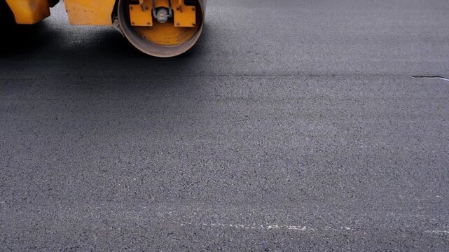 Single Drum Road Roller Compacting Fresh Smooth Asphalt Surface