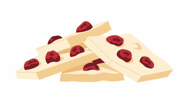 A pile of rectangular pieces of creamy, light-yellow nougat embedded with dried red berries
