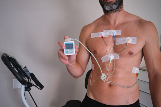 Man holding holter monitor for heart examination