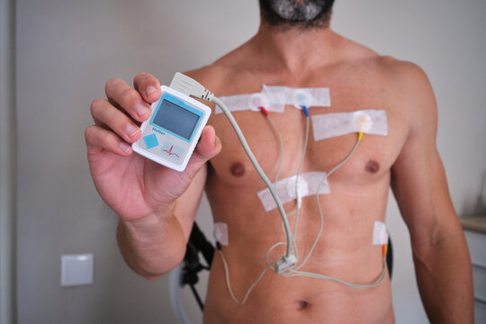 Man holding holter monitor for heart examination