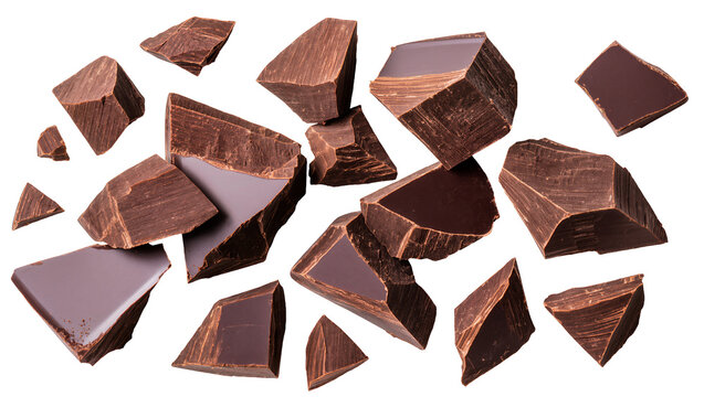 Dark chocolate chunks scattered, isolated on transparent background