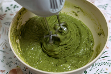 Fototapeta premium Baking matcha muffins at home.