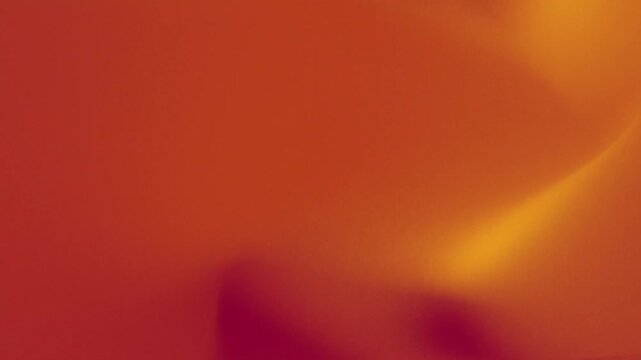 A vibrant video showcasing a beautiful sunset with warm orange hues. looping background animation with noise effect