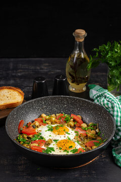 Healthy Breakfast with Fried Eggs and Vegetables in Frying Pan