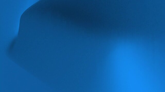 Abstract blue background with smooth gradient and soft shadows