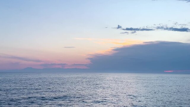 sea ​​coast at sunset, stormy waves